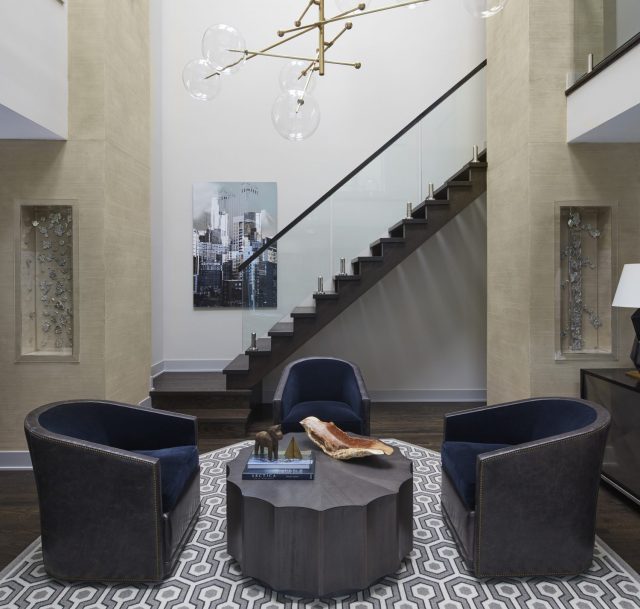 studio-brunstrum-interior-design-project-living-area-with-navy-chairs-modern-light-fixture