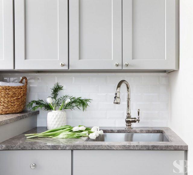 Gray cabinets mudroom sink with flowers