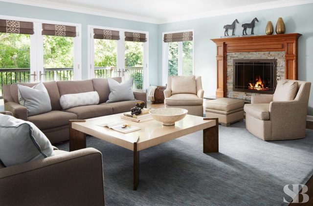 family room with light blue walls and a light brown sofa
