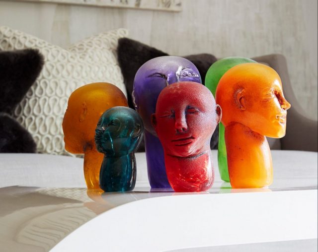colorful face sculptures