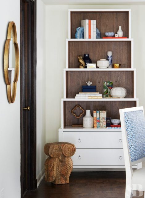 bookcase and wooden owl