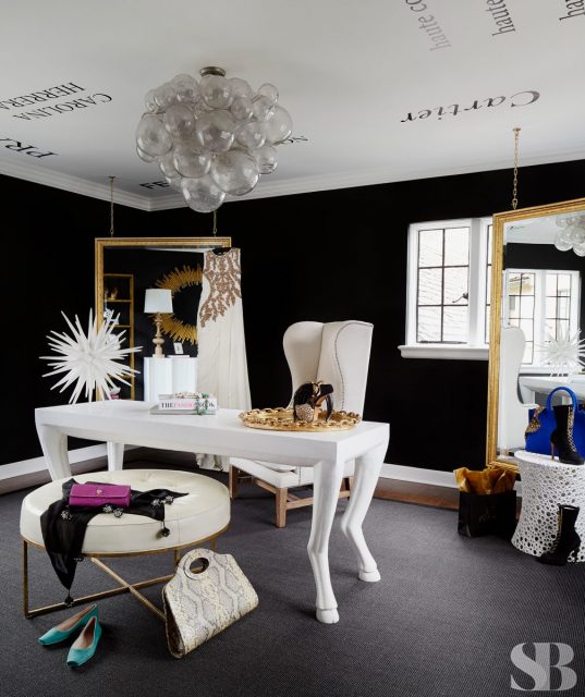 white desk with high backed chair and oval ottoman