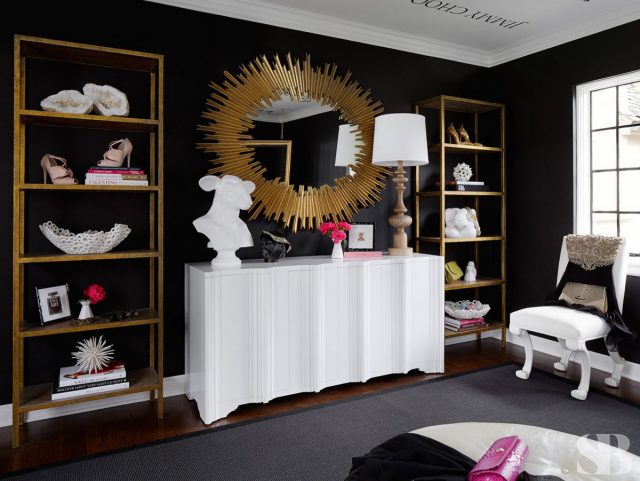 white cabinet with gold oval exploded mirror