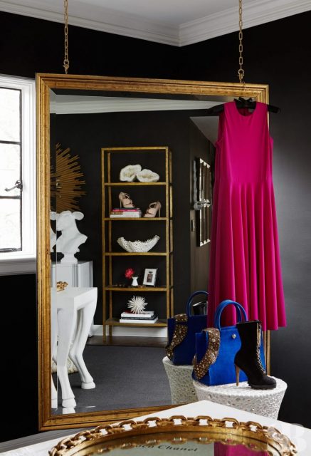 hanging golded mirror with dresses and shoes