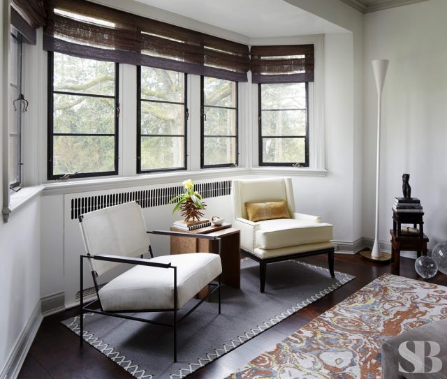 mismatched arm chairs in window