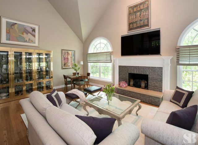 family room with two loveseats and a fireplace