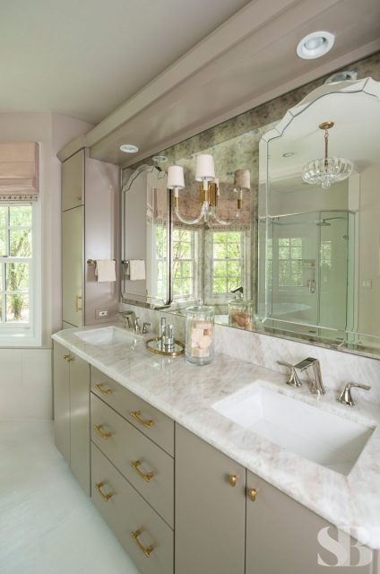master bath with two sinks and marble countertops