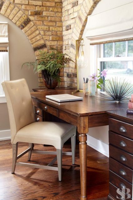 wooden desk with upholstered chair