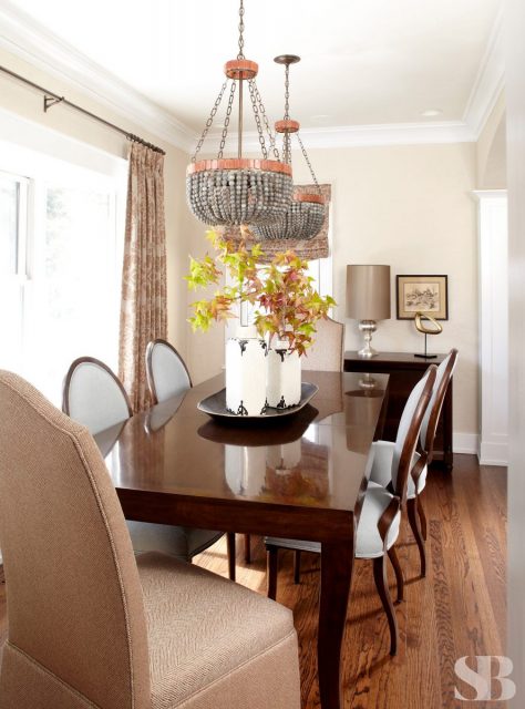 dining room with two beaded chandeliers
