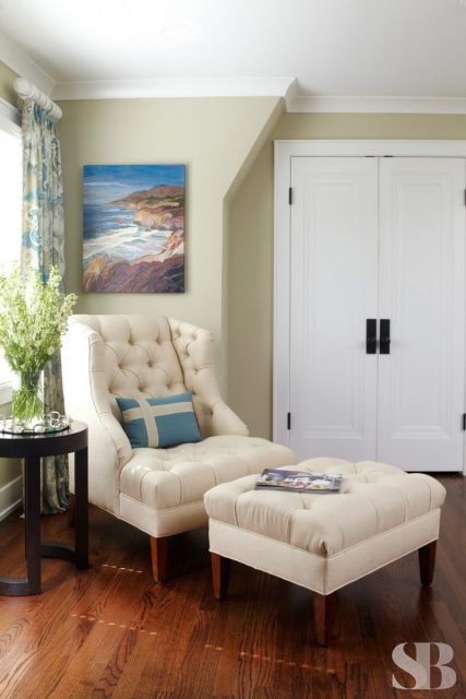 master bedroom reading nook with arm chair and ottoman