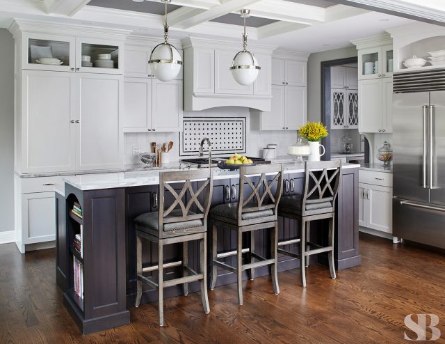 kitchen remodel with island, dark cherry wood cabinets, barstools, egg drop light fixtures