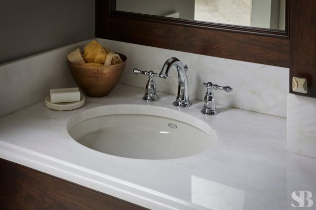 master bathroom sink with while countertops
