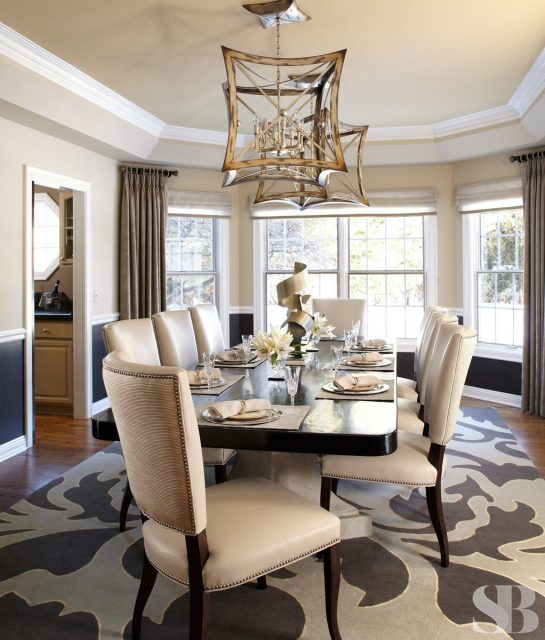 dining room with upholstered seats and geometric chandelier