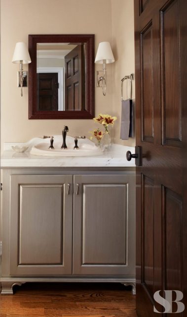 guest bathroom with gray cabinets
