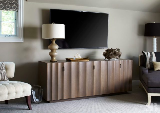 wooden wavy chest and mounted tv