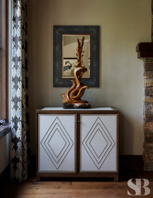 cabinet with wooden sculpture