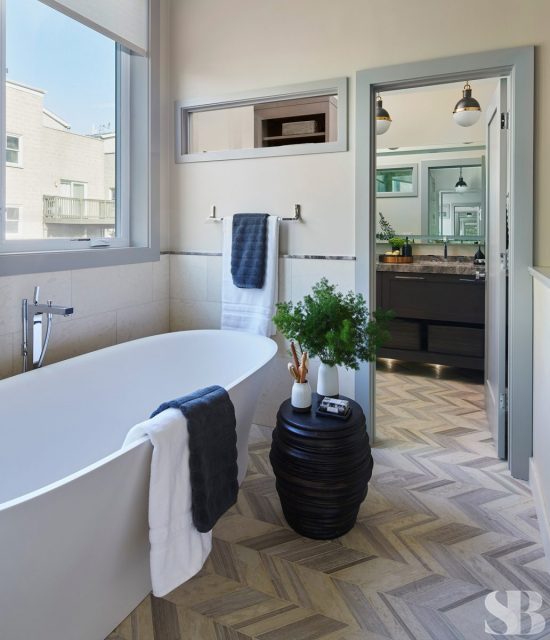 bathroom and bathrub with chevron tile pattern