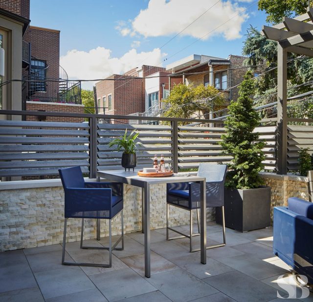 tight table patio seating with navy chairs