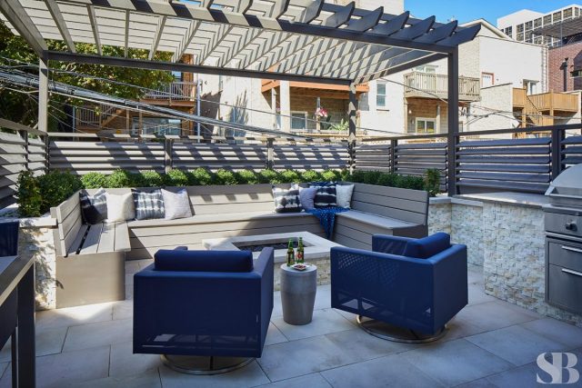 inset patio with fireplace and two additional navy seats