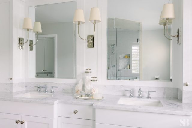 white bathroom with two sinks and mirrors