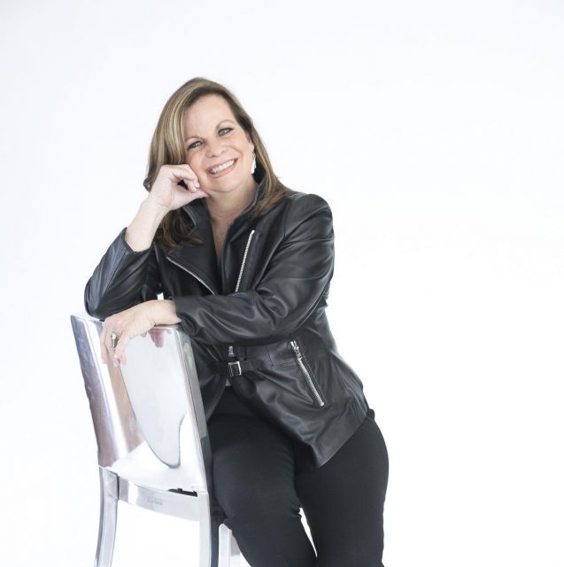 Susan Brunstrum sitting on a chair
