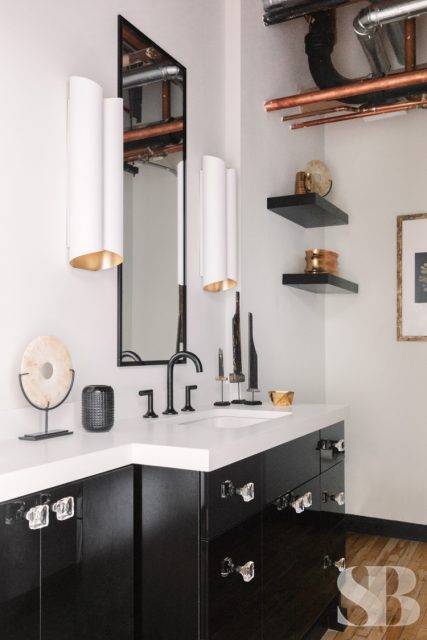 office bathroom with black cabinets